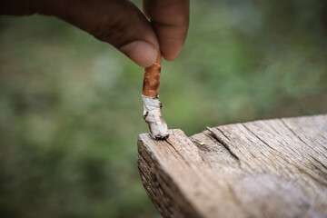 destroying smoking on wooden table for stop smoking concept idea
