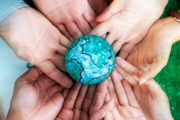 Business hands holding warming the world environment concept Coexistence of entrepreneurs and the environment