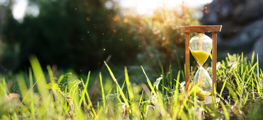 Hourglass in nature. Idea of ecology, time and preserving the earth