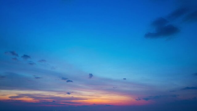 Aerial hyperlapse sweet sky cloud scape in colorful sunset.
colorful light through to the cloud above the ocean.
Scene of Colorful romantic sky sunset background.