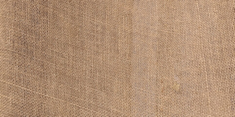Fototapeta na wymiar Brown sackcloth texture or background and empty space. Closeup of burlap hessian sacking