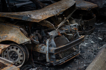 Dnepr, Ukraine – January 6: Russian drones attacked the Dnieper. Burnt and damaged cars in the Dnieper. Utility services clean up the aftermath of the attack on the city.
