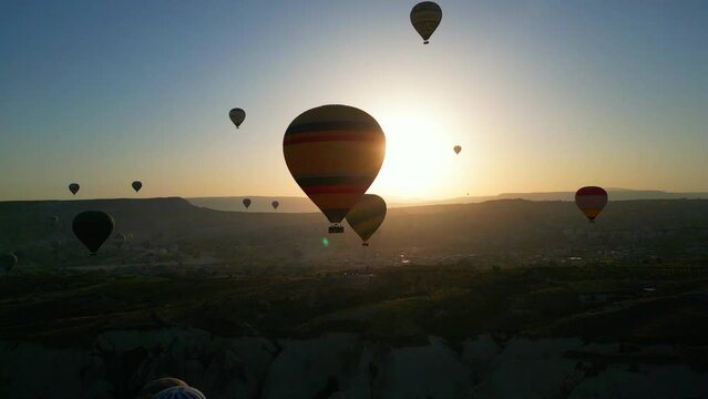 Aerial view of back light amazing hot air balloons in Cappadocia - Turkey.