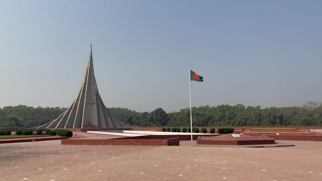 National Martyr's Memorial of Bangladesh National Monument with Flag of Bangladesh Waving
