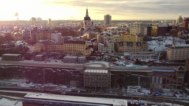 The Katarina church in the district of S&ouml;dermalm from above and the view towards the Ericsson Globen, in the cold winter sun with snow on the roofs. With swedish spreading rights.