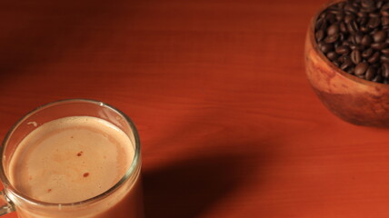 Indonesian coffee on wooden background. Coffee Beans in wooden container.