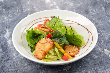 salad with fish nuggets and sauce