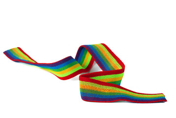 Colorful rainbow ribbon closeup isolated on white background. Colorful LGBT design. Curly, fluttering ribbon.