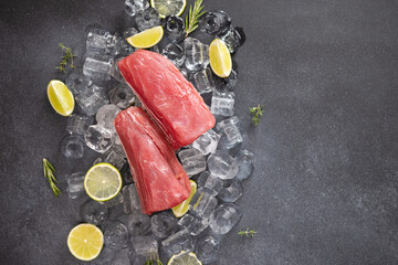 Fresh cooled tuna Fish steak lays on ice