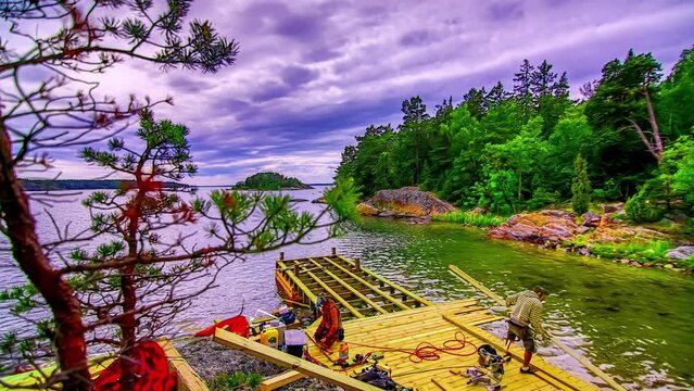 Building a wooden boat dock on a lake - sliding motion time lapse cloudscape