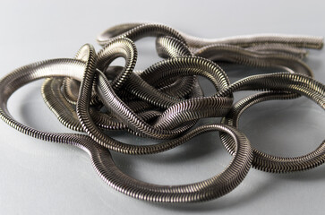 Roll of metal chain on white background