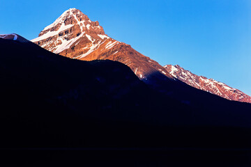 Mountain peak in alpenglow at the sunset