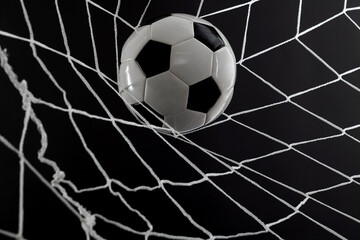 Soccer ball goal success on black background