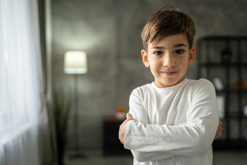 One boy caucasian child seven years old kid at home schoolboy portrait