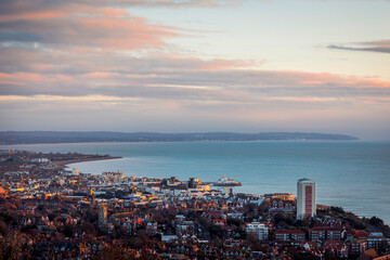 January sunrise from Beachy head over the coastal town of Eastbourne on the east Sussex coast south east England UK