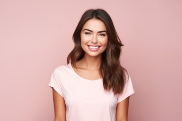 portrait of young happy smiling beautiful woman in casual clothes, over pink background