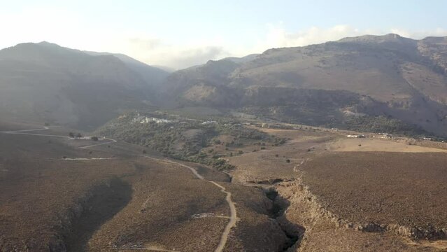 Drone footage of the scenic White Mountains (Lefka Ori) in Chania city in the Greek island of Crete