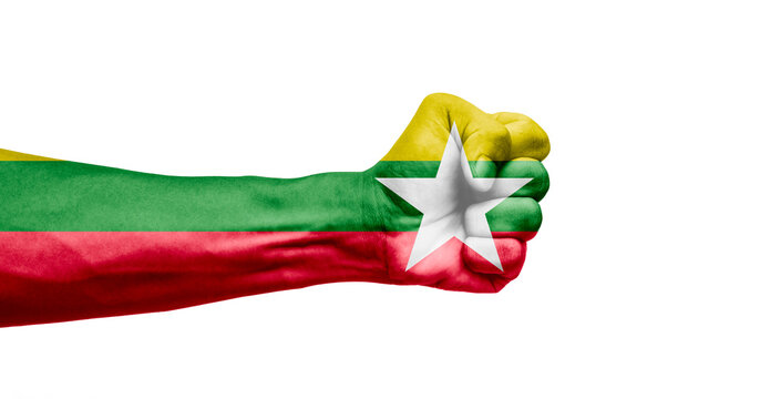 Man hand fist of Myanmar flag painted