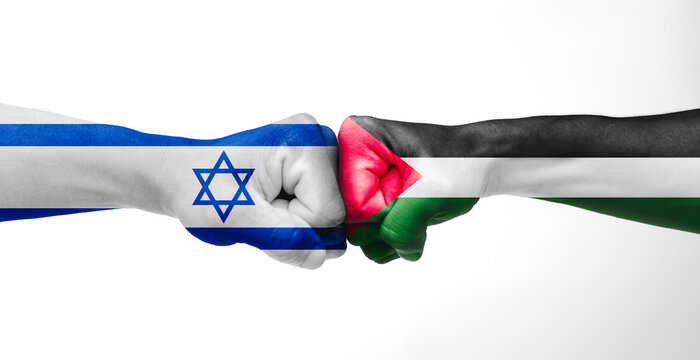 Man giving fist bump with Israel and Palestine flags painted on hands