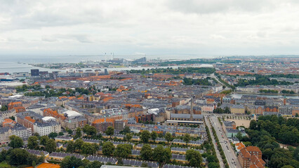 Fototapeta na wymiar Copenhagen, Denmark. Copernhagen lakes. Panorama of the city center and port in cloudy weather. Summer day, Aerial View