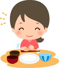 食事を終えて箸を置く笑顔の女性