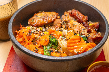 angle view Korean chicken bibimbap with cup of coffee at horizontal composition