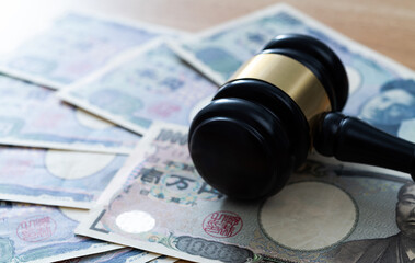 Gavel on stack of yen
