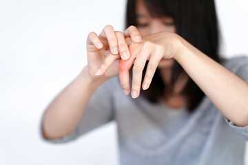 Woman has finger joint pain due to rheumatoid arthritis. Health care concept.