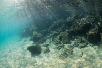 Rock and sand on the ocean floor.