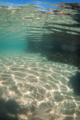 Light pattern on the sandy ocean floor.