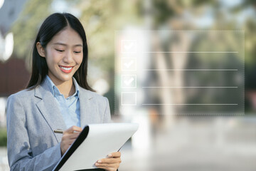 Businessman using tablet to do online checklist survey, doing assessment online survey answer test questions Digital form.