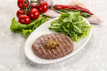 Frilled beef burger cutlet with iceberg