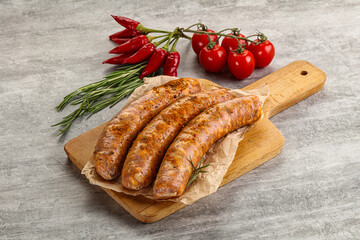 Raw sausages with spices and herbs