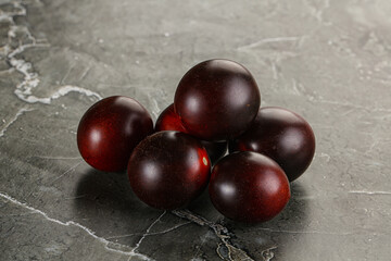 Raw ripe black kumato tomato