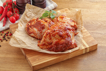 Marinated chicken leg in tomato sauce