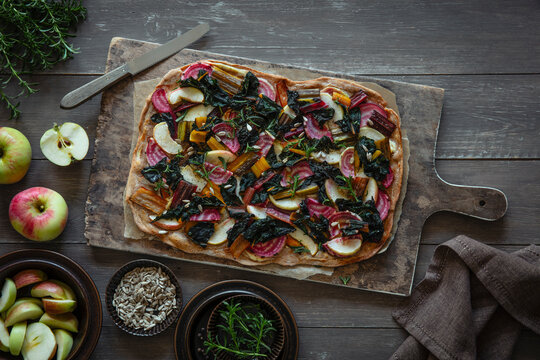 Studio shot oftarteflambeewith chard, apples and beetroot