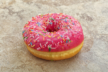 Sweet glazed struwberry donut with icing