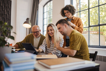Person with disability working with colleagues in inclusive community office