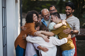 Diverse group of community members embracing successful community project