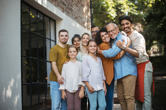 Diverse group of community members embracing successful community project