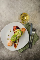 salmon with avocado on a plate