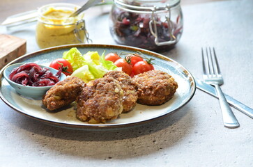 a traditional Czech dish of fried meatballs, minced meat with vegetables,