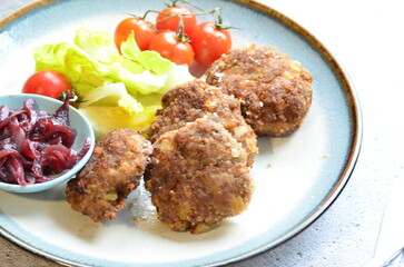 a traditional Czech dish of fried meatballs, minced meat with vegetables,