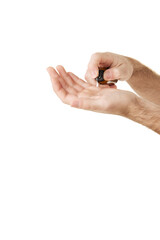 Cropped unrecognizable man applying body cream to hand on palm while standing against white studio background. Concept of male facial care routine, cosmetic product, body care, anti-aging.