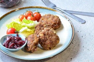 a traditional Czech dish of fried meatballs, minced meat with vegetables,