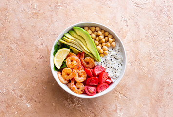 Bowl with rice, shrimp, avocado, tomato, chickpeas and lime. Healthy eating. Diet.