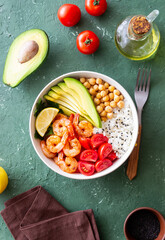 Bowl with rice, shrimp, avocado, tomato, chickpeas and lime. Healthy eating. Diet.