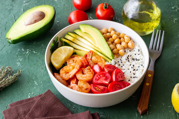 Bowl with rice, shrimp, avocado, tomato, chickpeas and lime. Healthy eating. Diet.