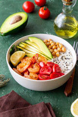 Bowl with rice, shrimp, avocado, tomato, chickpeas and lime. Healthy eating. Diet.