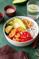 Bowl with rice, shrimp, avocado, tomato, chickpeas and lime. Healthy eating. Diet.